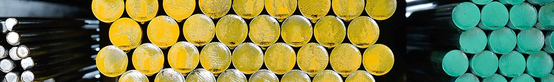 Round steel bars stacked in warehouse